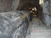 Pipe laying through tunnels